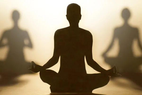 Graphic of three people meditating