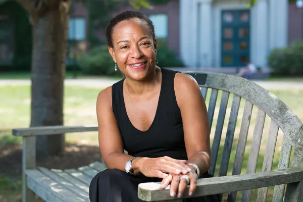 Monica Dean on a bench outside Bass Hall