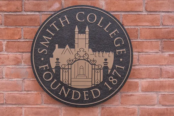 Closeup of the college seal on the entry gates
