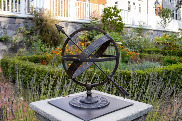 metal globe and sundial