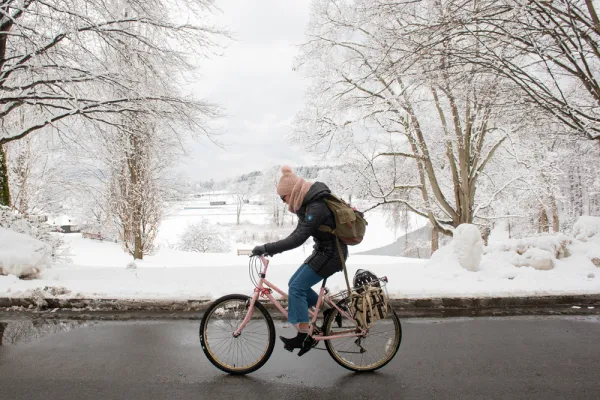 Riding a bike through a snowy landscape