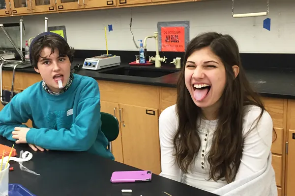 Northampton High School students try paper soaked in PTC, a substance that tastes bitter to some but is tasteless to others.