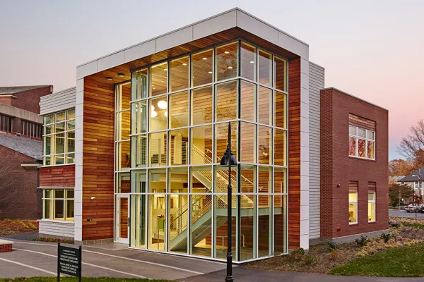 glass and wood building against blue sky