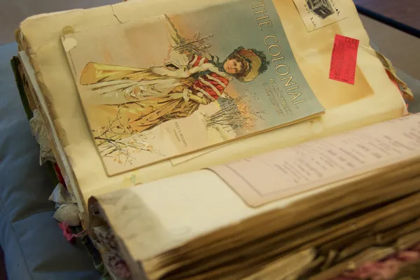 Pages from a scrapbook with a program for a musical event