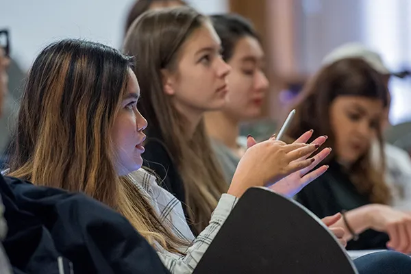 Students in auditorium facing forward