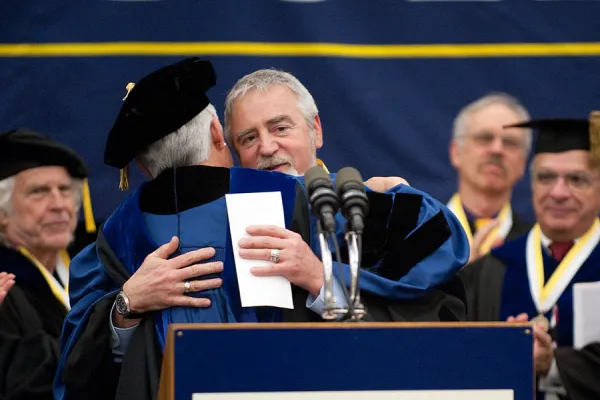 Tom Riddell receives the honored professor award from President Christ