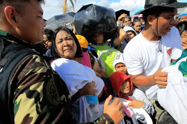 People trying to get aide during crisis