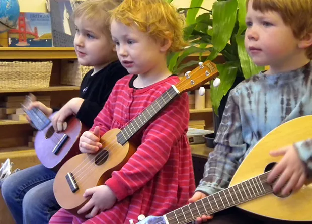 Three children with guitars