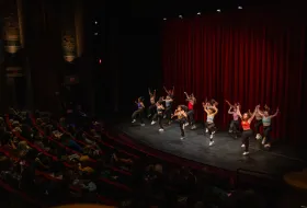 A group of dancers on the stage in Mendenhall