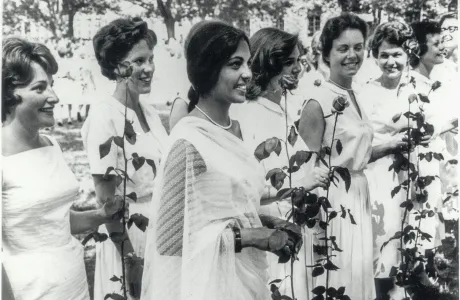A group of students in 1963, holding roses on Ivy Day