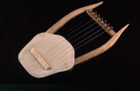 A simple, ancient lyre with a wooden frame and seven strings