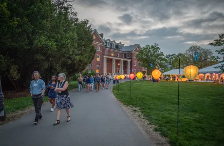 People walk through campus during Illuminations