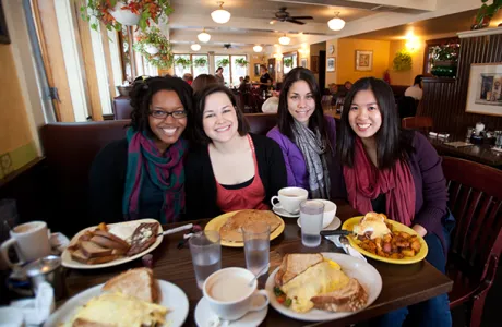 Four Smith students eating breakfast at Sylvester's restaurant in downtown Northampton.