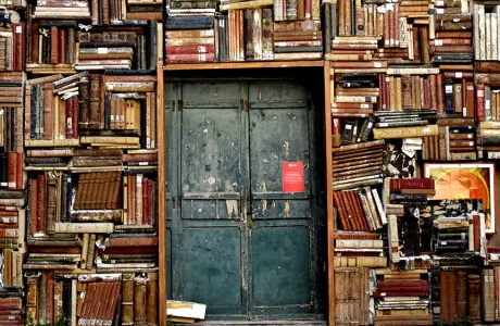 Italian doorway surrounded by stacks of books