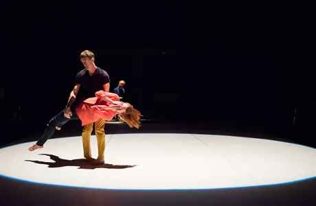 Two dancers in a spotlight