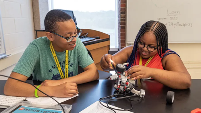 Two students working together in a robotics class