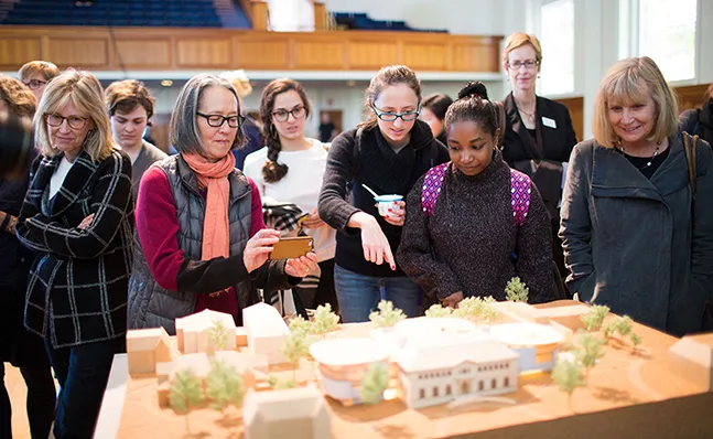 Students viewing the model of the new Neilson Library