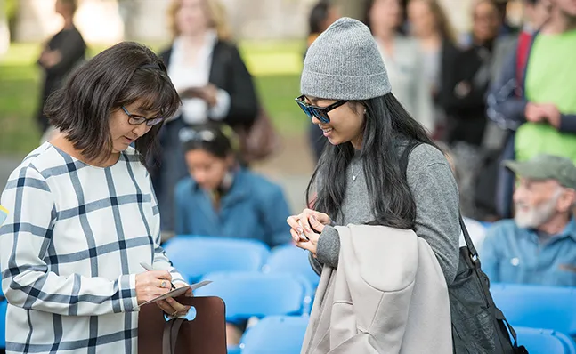 Student gets an autograph from Maya Lin