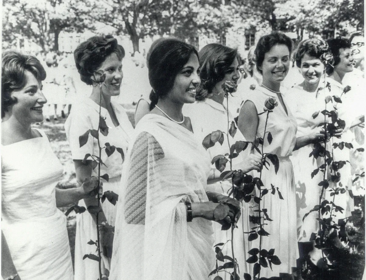 A group of students in 1963, holding roses on Ivy Day
