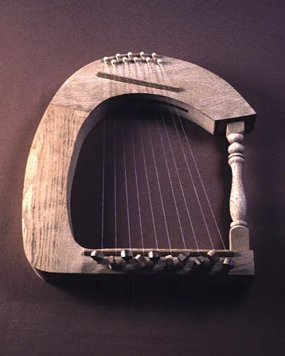A wooden harp with a curved frame, ten strings, and a crafted arm