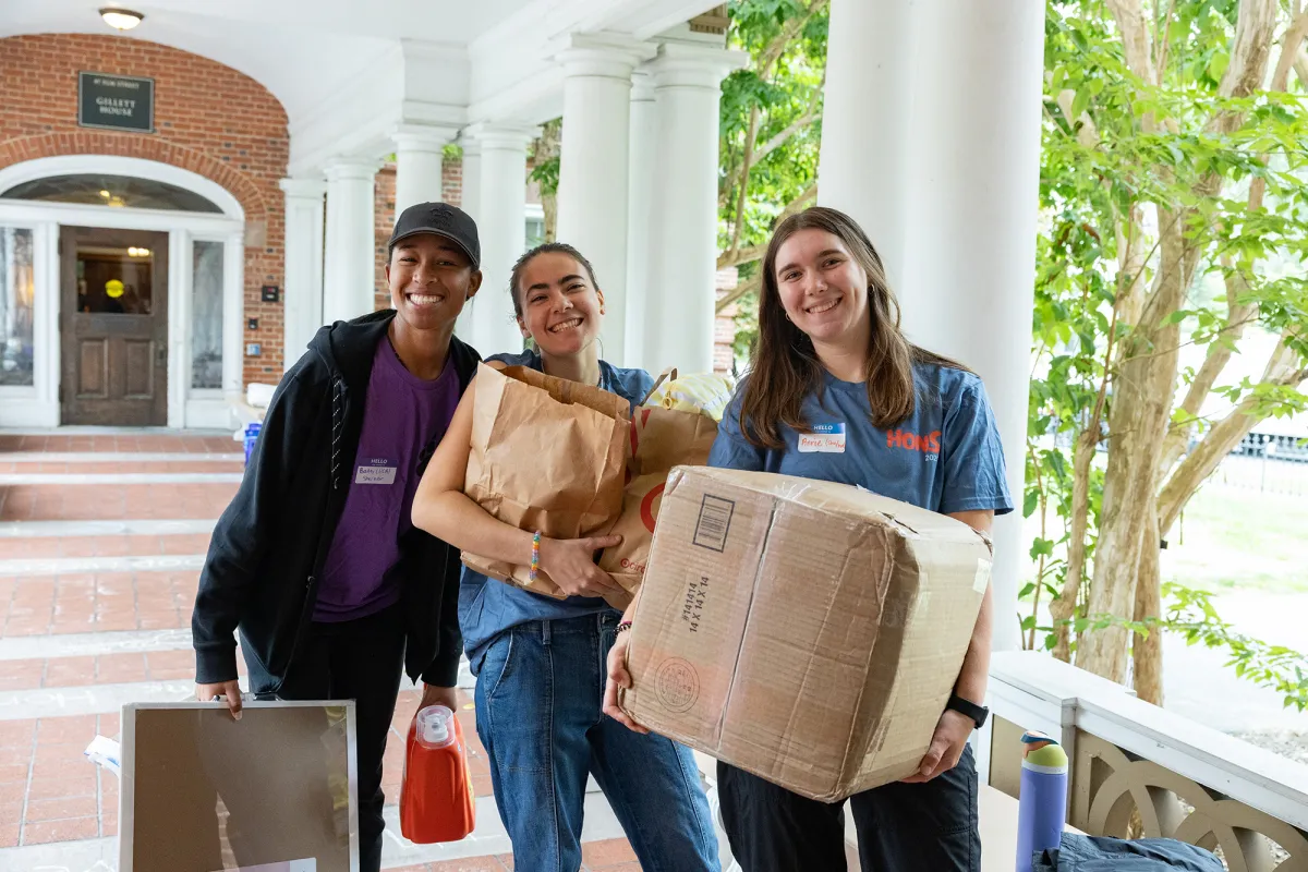 housemates help a new student move belongings into Northrop-Gillett