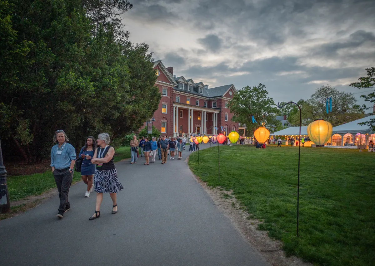 People walk through campus during Illuminations