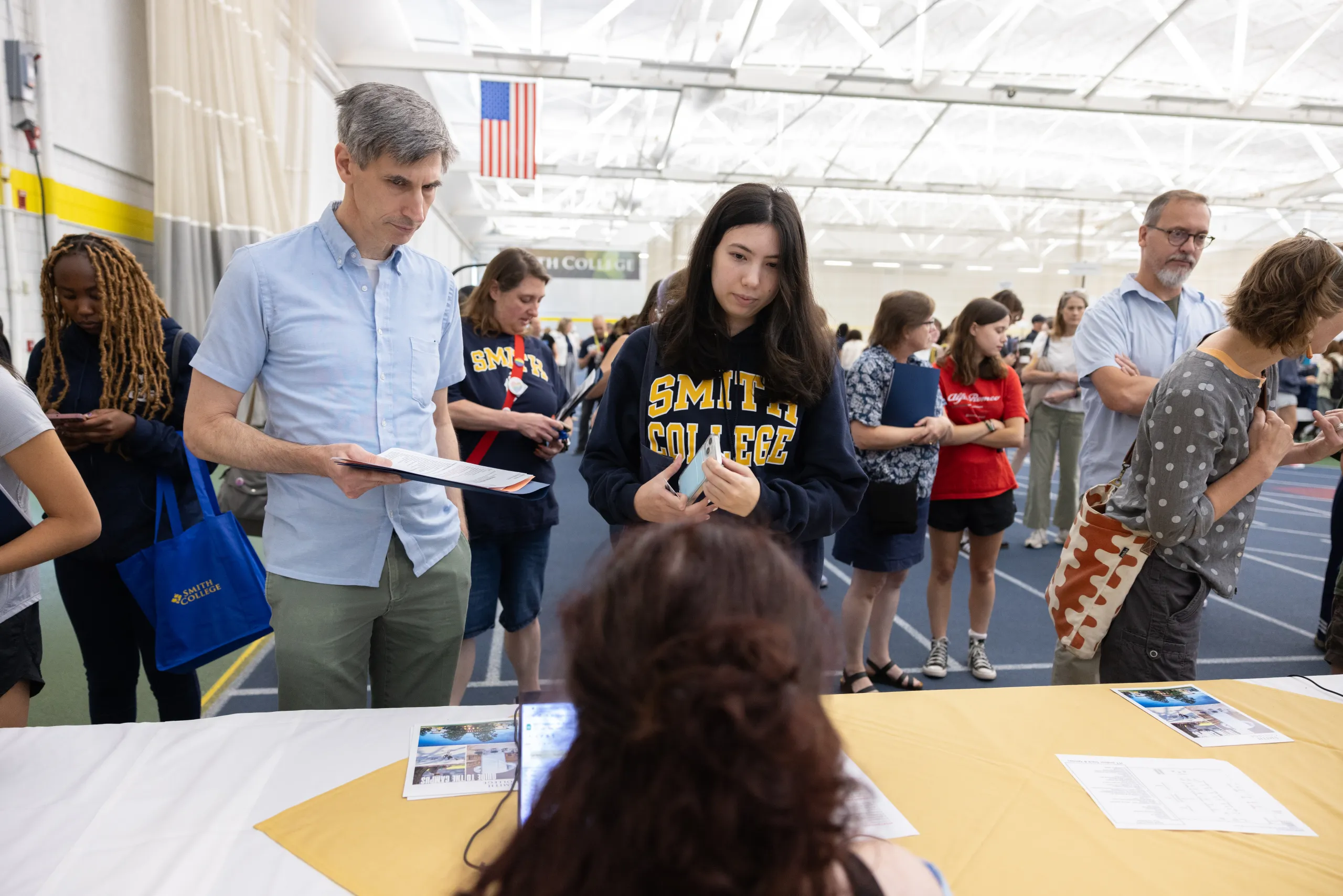 A student and their parent at central check-in
