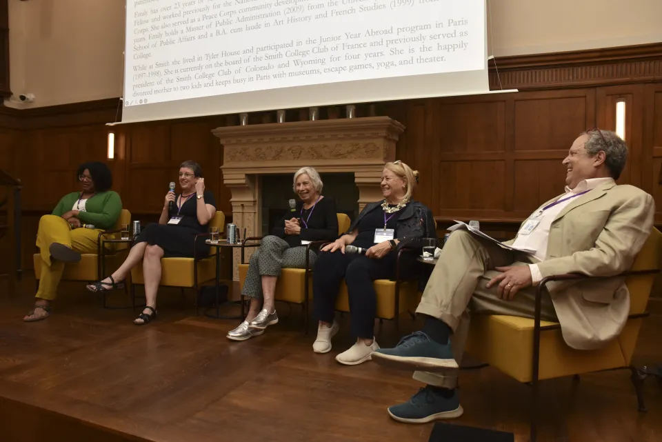 People on stage during a panel talk in Paris
