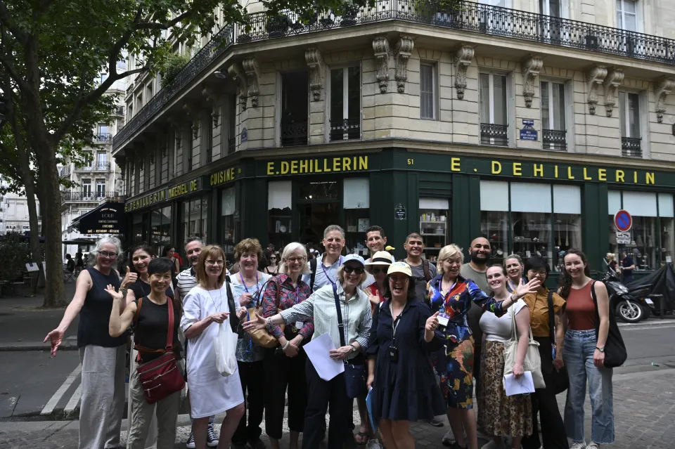 A group of people in front of a cafe in Paris