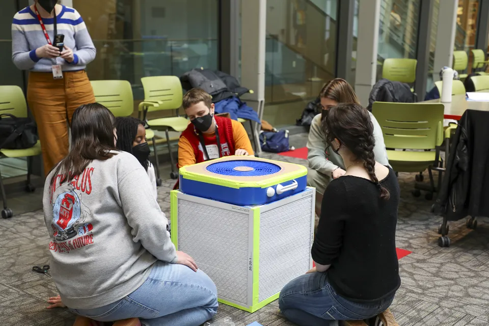 Finnegan Shannon creates DIY air purifiers with Smith students.