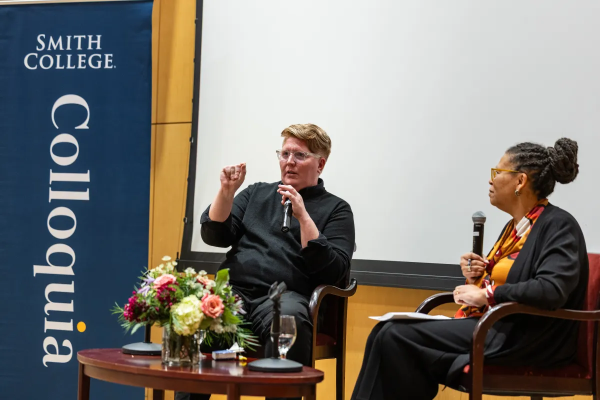 Amanda Ballantyne and Sarah Willie-LeBreton talk during the presidential colloquium.