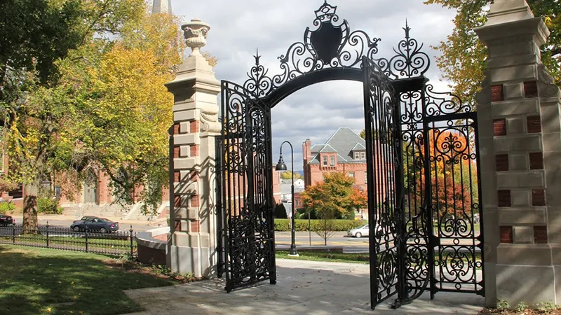 Open College Hall gates in the fall