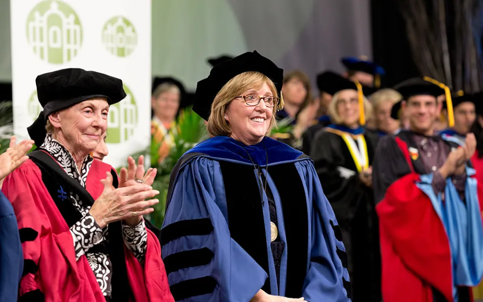 President McCartney onstage with dignitaries