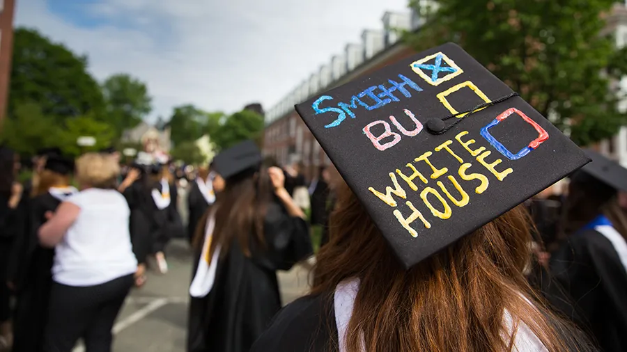 Student wearing a mortar board saying Smith - BU - White House