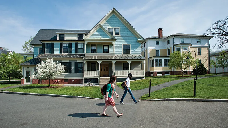 Students walking past a residential house