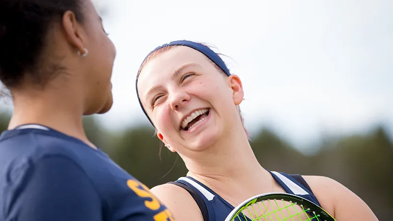 Kara VanAllen and a teammate on the tennis court