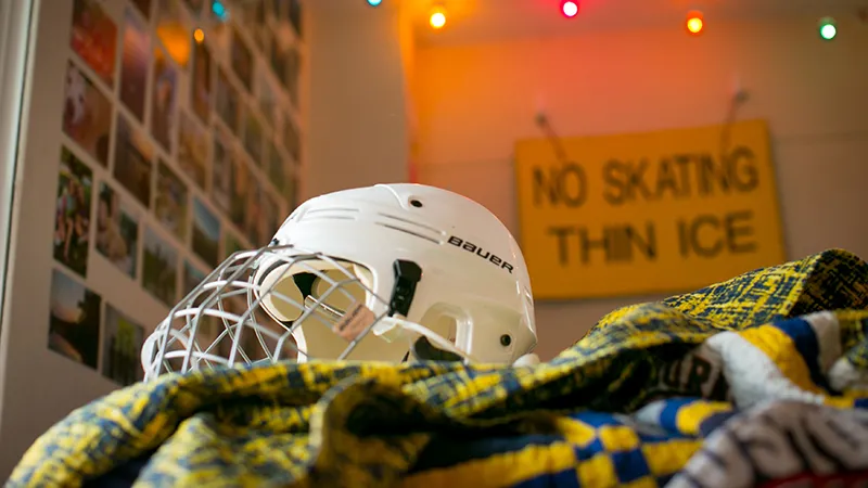 Hockey helmet and No Skating sign in Meg Johnson's room