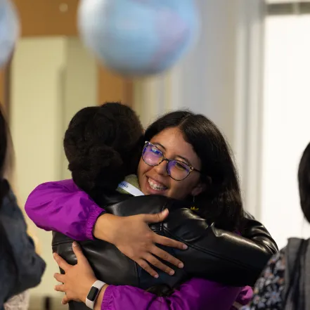 Two alums hug during Reunion festivities