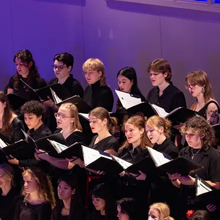 Students in the glee club singing